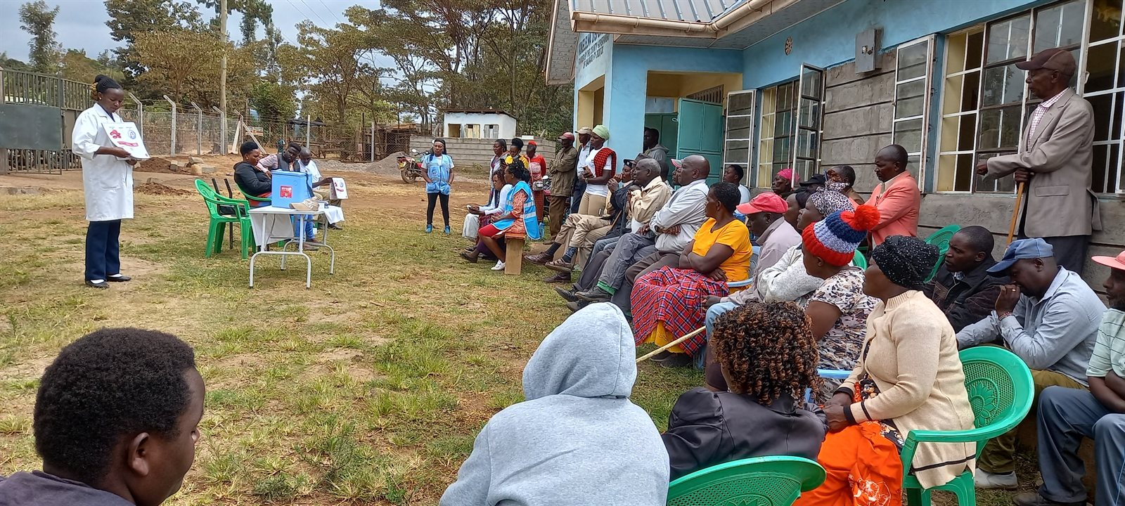 Community members waiting outside a dispensary during an outreach